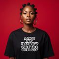 Woman wearing a black t-shirt with text on a red background