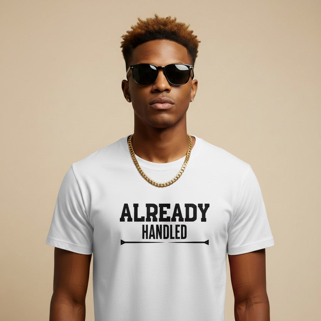 Man wearing a white t-shirt with 'ALREADY HANDLED' text on a beige background
