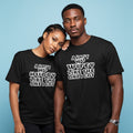 Two people wearing black t-shirts with humorous text designs on a blue background