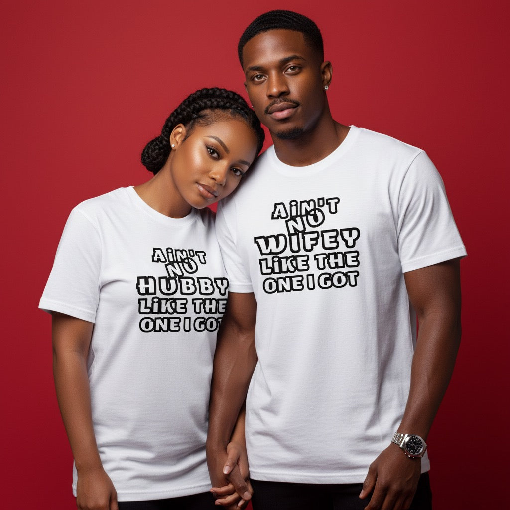 Two people wearing white t-shirts with humorous text designs on a red background