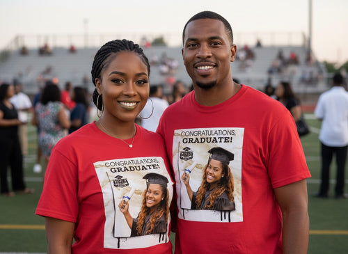 Two people wearing red t-shirts with graduation-themed graphics and text.
