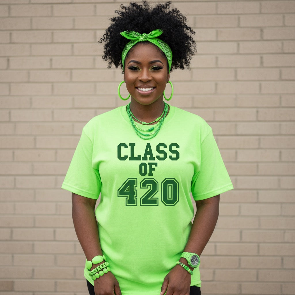 Person wearing a bright green 'CLASS OF 420' t-shirt against a brick wall.