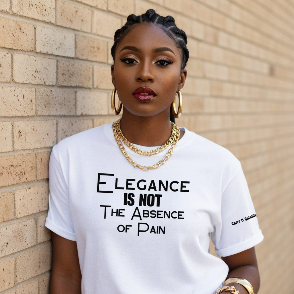 Woman wearing a white t-shirt with a motivational quote against a brick wall.