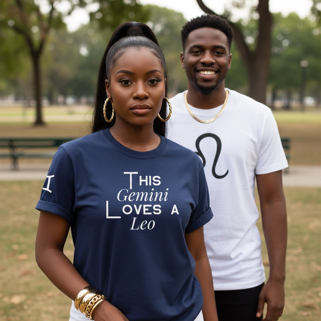 Two people wearing t-shirts with zodiac signs in a park setting