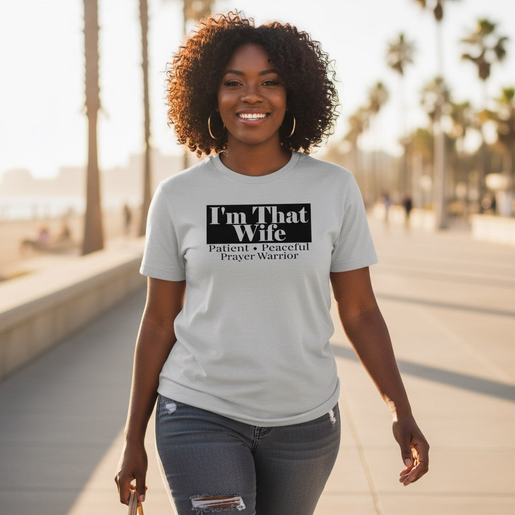 Woman wearing a t-shirt with text on a sunny day outdoors