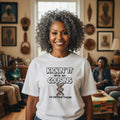 Person wearing a t-shirt with a humorous message in a living room setting.
