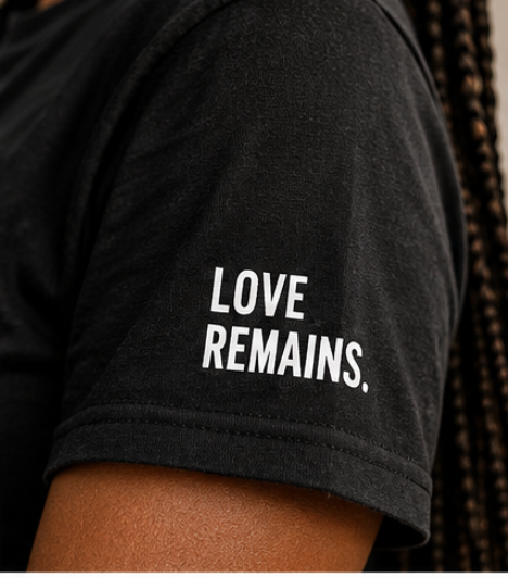 Close-up of Love Remains. sleeve detail on Still Us. t-shirt