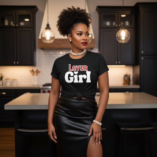 Woman wearing a black t-shirt with 'LOVER Girl' text in a kitchen.