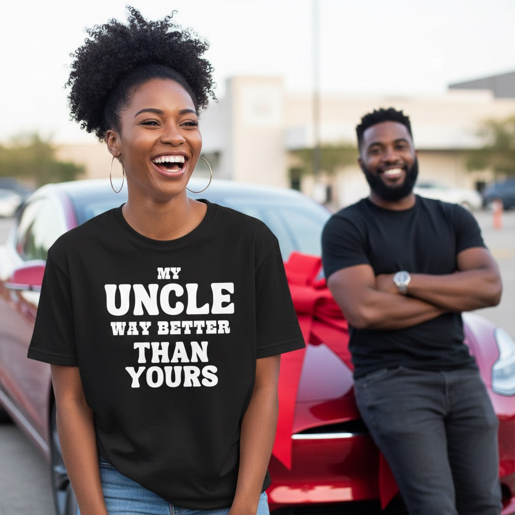 Two people standing in front of a red car with a humorous t-shirt text.