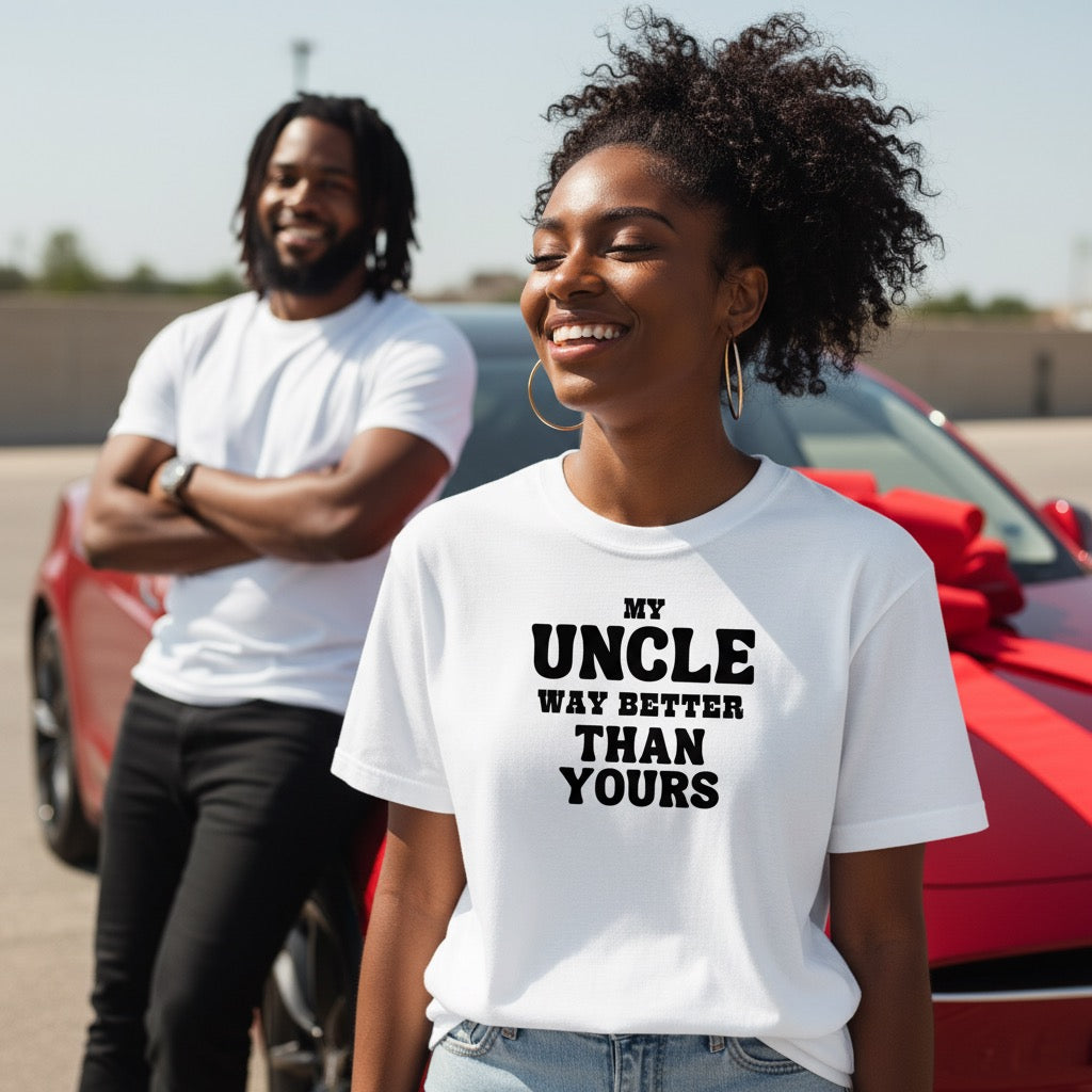 Two people standing in front of a red car, one wearing a white t-shirt with text.