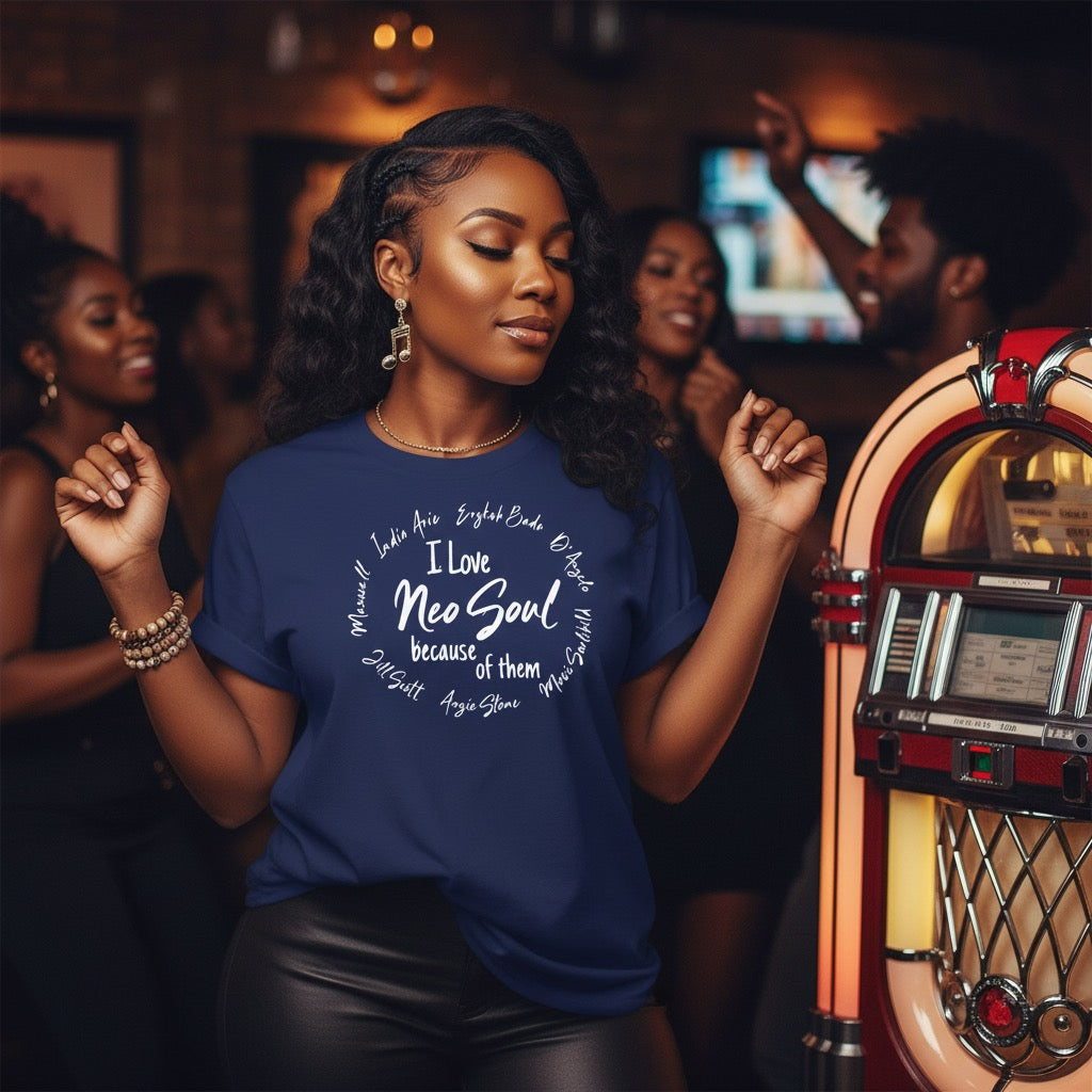 Woman wearing a blue t-shirt with text, standing in front of a vintage jukebox in a lively setting.