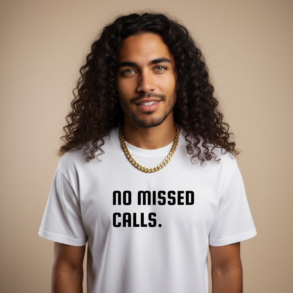 Man wearing a white t-shirt with 'no missed calls.' text on a beige background