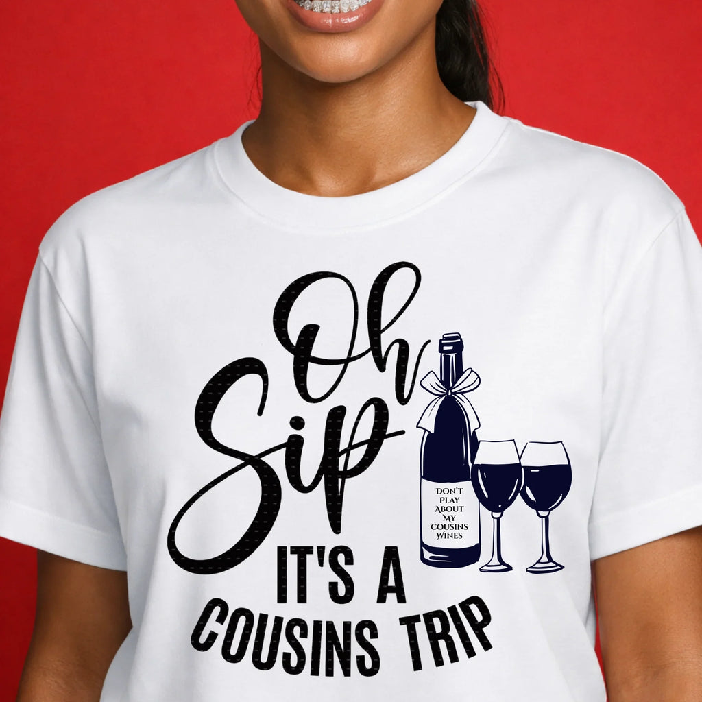 Woman wearing white graphic t-shirt with 'Oh Sip It’s a Cousins Trip' and wine bottle design