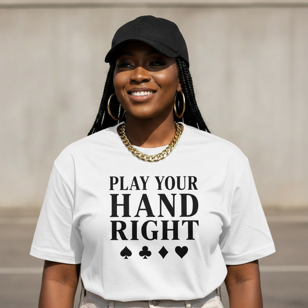 Person wearing a white t-shirt with 'Play Your Hand Right' text and playing card symbols.