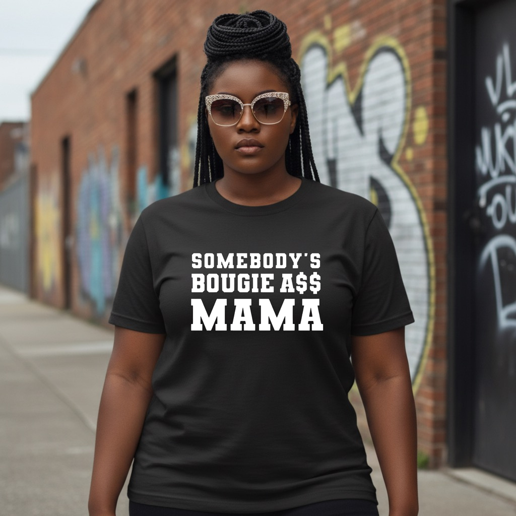 Woman wearing black graphic T-shirt that says 'Somebody's Bougie A$$ Mama' outdoors