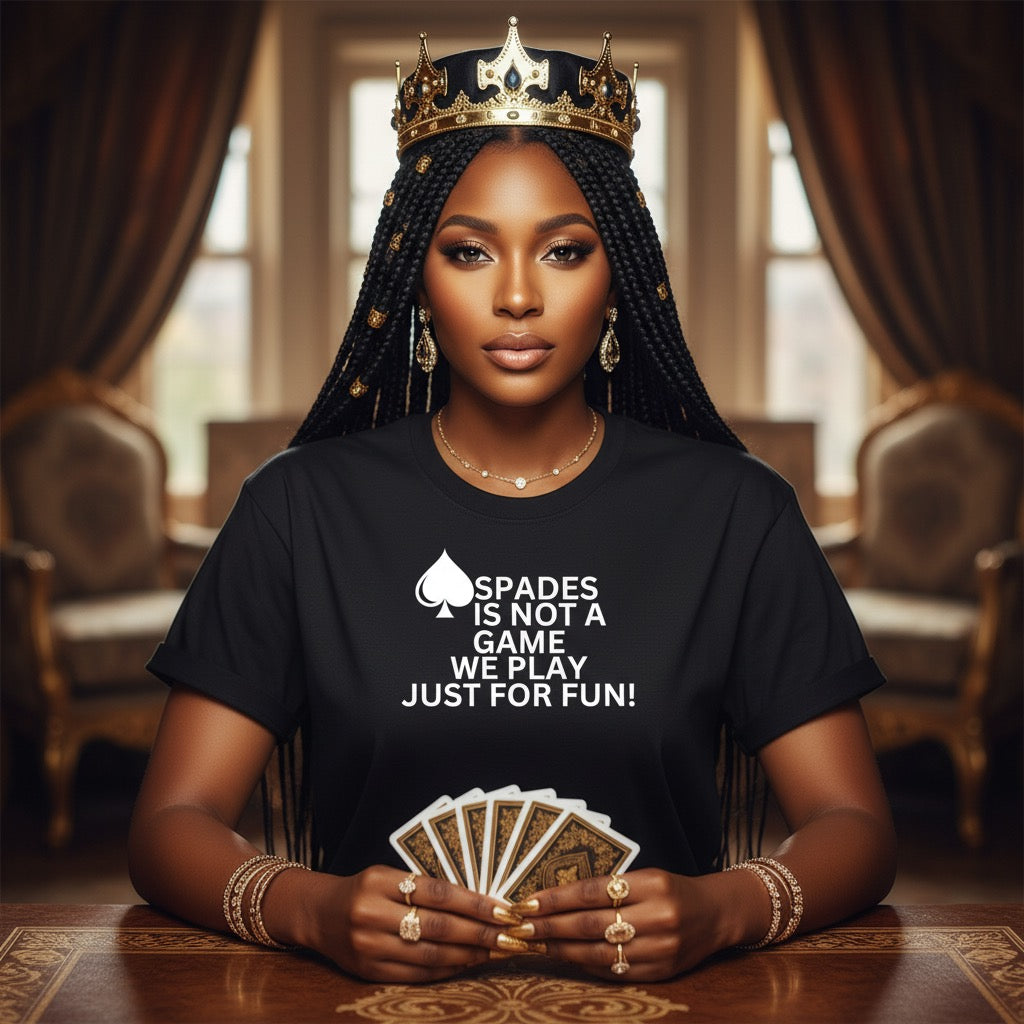 Woman wearing a black t-shirt with a spades design and text, holding playing cards in an elegant room.