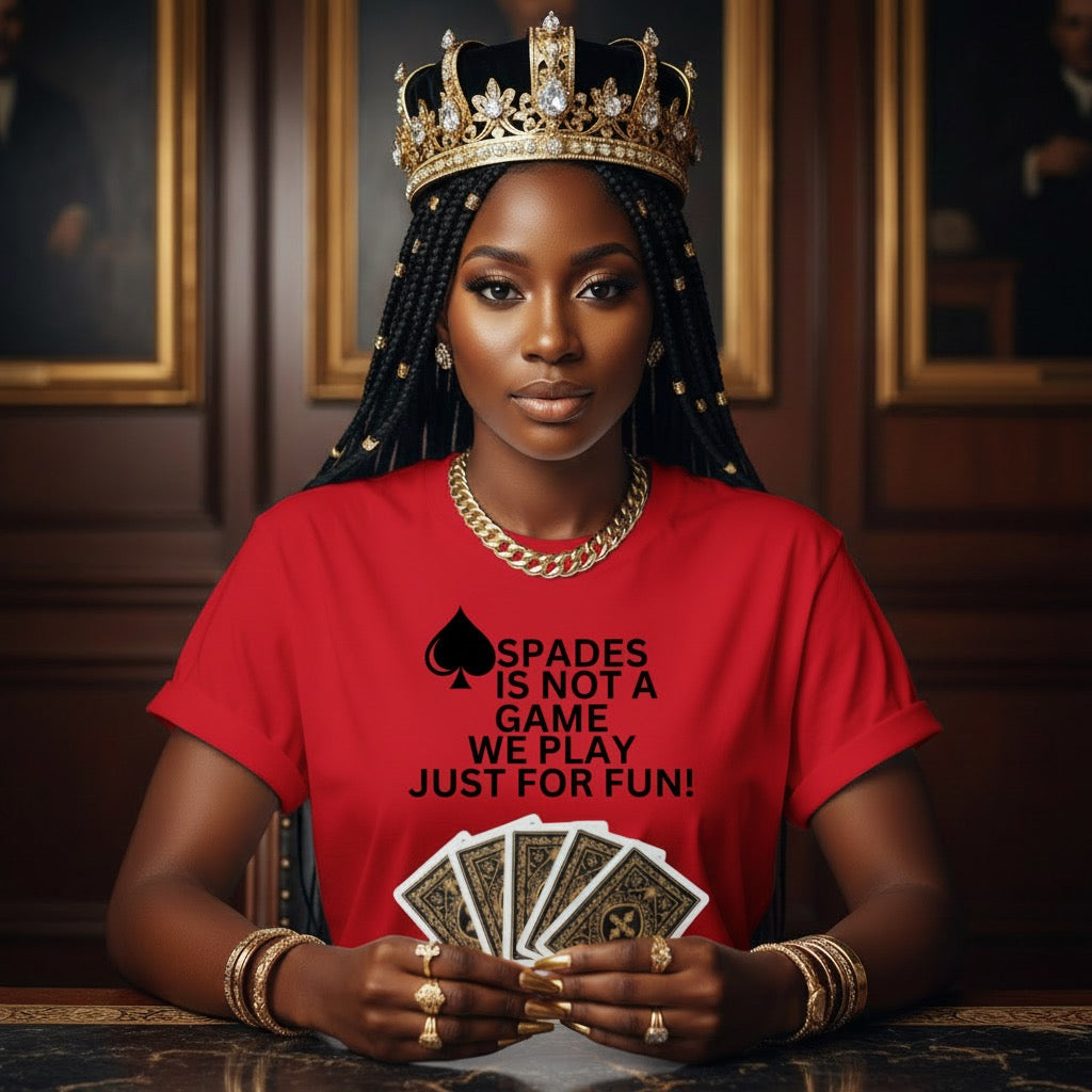Woman wearing a red shirt with a spades design and text, holding playing cards in a formal setting.