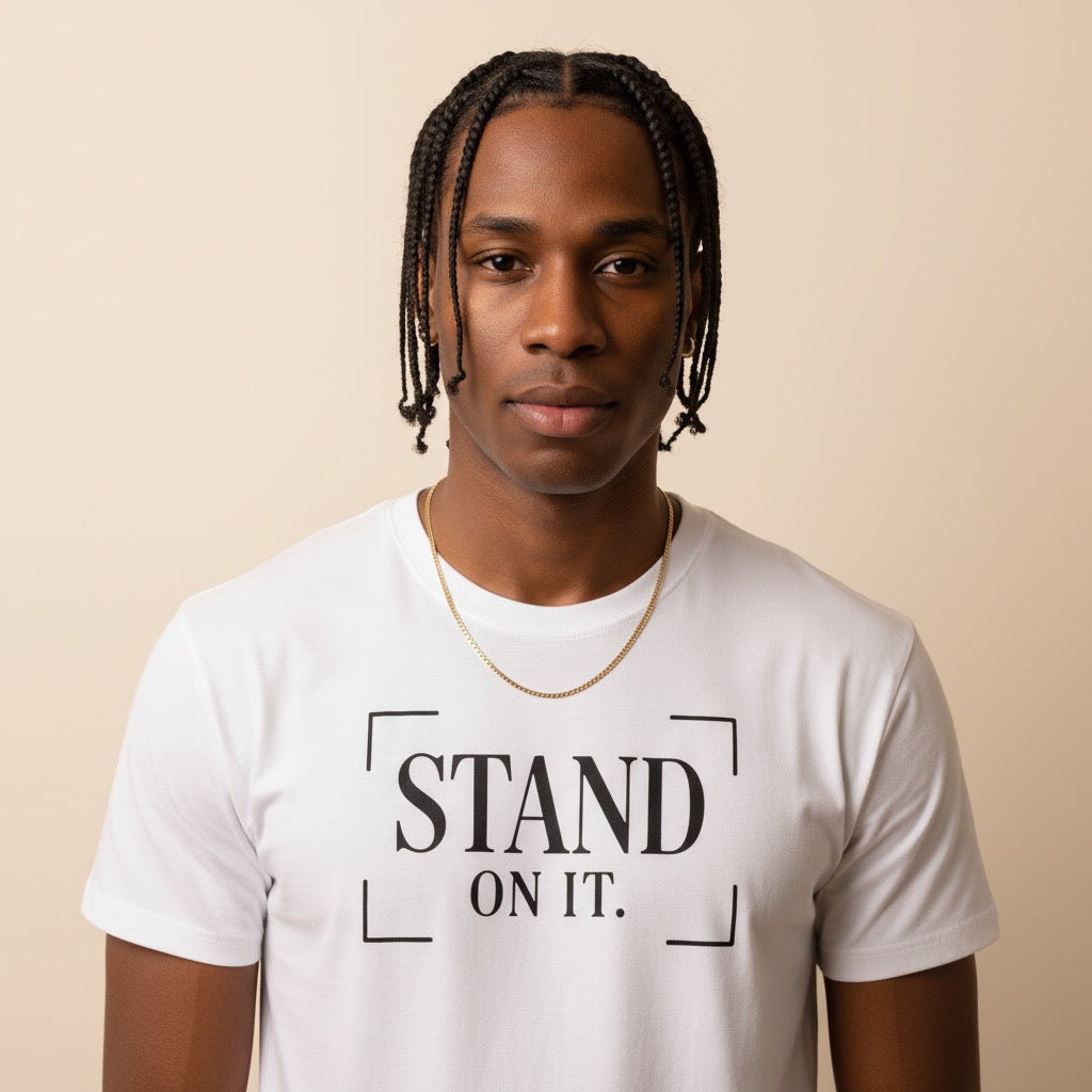 Man wearing a white t-shirt with 'STAND ON IT.' text on a beige background