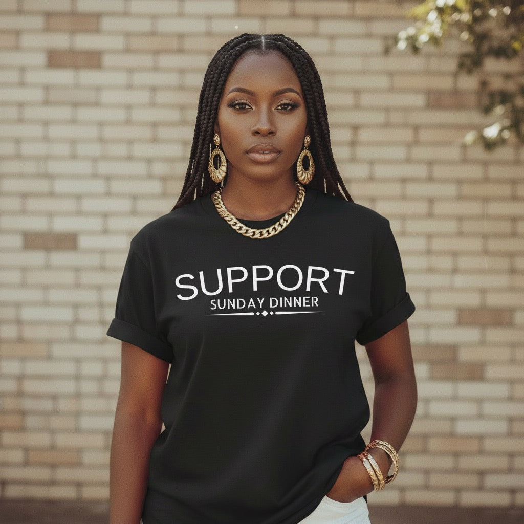 Black unisex statement t-shirt reading “Support Sunday Dinner” inspired by Black family traditions
