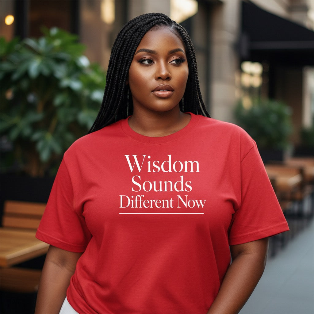 Red unisex shirt with “Wisdom Sounds Different Now” typography graphic