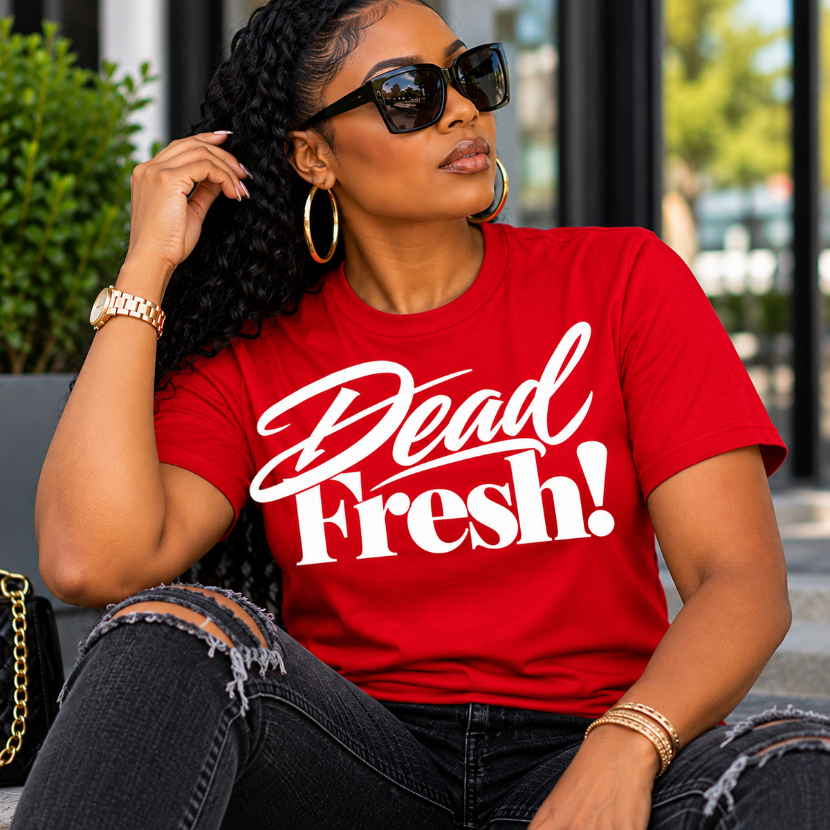 Bright red crew-neck T-shirt featuring the Dead Fresh! graphic in bold white script and serif lettering.