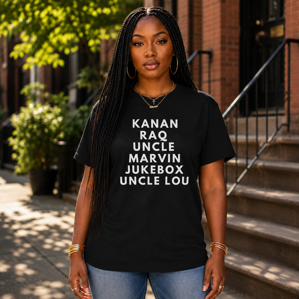 Black woman wearing the Raising Kanan Family Roll Call graphic tee in black with white typography.
