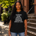 Black woman wearing the Raising Kanan Family Roll Call graphic tee in black with white typography.